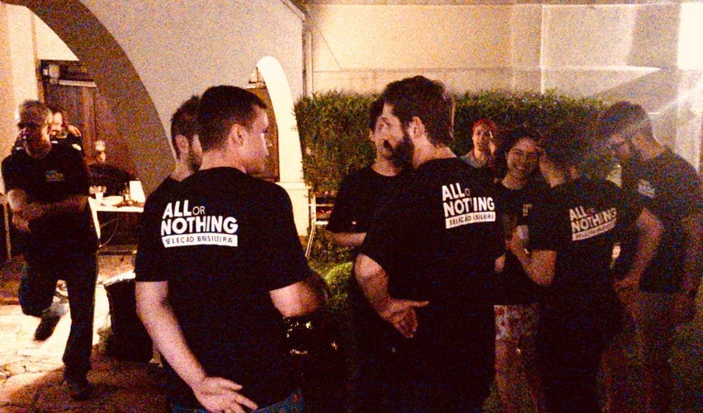 A group of people standing around each other.